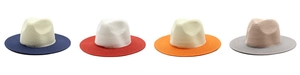 Detailed comparison of four two-tone Panama straw hats with various brim colors in flat lay