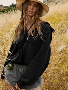 Women's black zip-up hoodie with drawstring and loose fit for casual outdoor wear