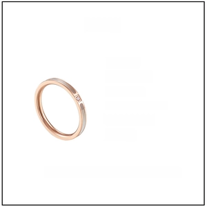 Detailed view of a 2mm rose gold titanium steel ring with white shell and single zircon