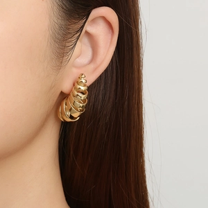 Fashionable gold spiral hollow teardrop earrings in polished stainless steel for women