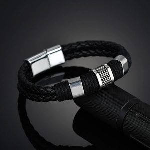 Men's black braided leather bracelet with silver magnetic metal clasp and textured rings