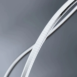 Detailed macro view of the sleek silver octagonal snake chain bracelet's smooth texture