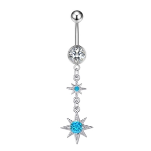 Detail of silver belly ring with clear zircon and blue star-shaped gemstones