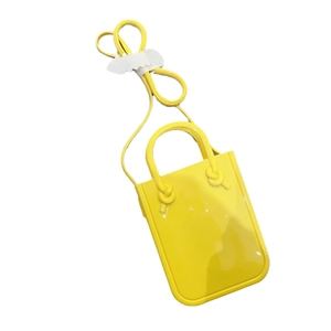 Modern yellow PVC jelly handbag with crossbody strap and minimalist candy style design
