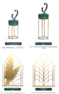 Gold metal watch stands and leaf backdrops with dimensions for window display set