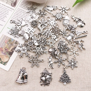 Detailed macro view of vintage silver alloy Christmas pendants with festive designs