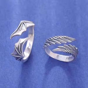 Pair of adjustable S925 sterling silver rings with angel and demon wing designs
