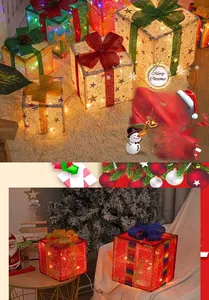 Close-up of glowing Christmas gift box set with warm LED lights and glittery star patterns