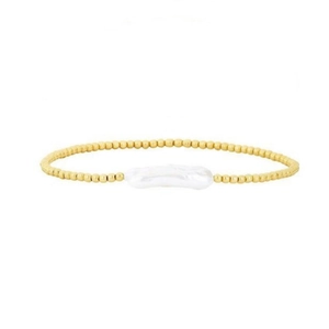 Detailed view of baroque freshwater pearl and 18K gold beads on minimalist elastic bracelet