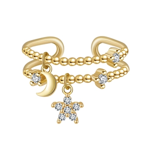Double-layered gold bead ring with star and moon charms and sparkling zirconia