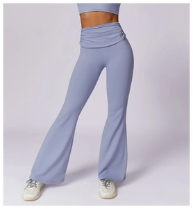 Detail of high-waisted yoga flare pants with ruched waistband in soft lavender color