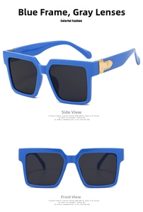 Detail of square blue sunglasses with grey lenses and golden metal logo hardware