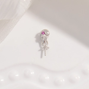 Macro shot of S925 sterling silver pendant base with red zircon and pin for pearl mounting