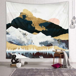Detailed view of abstract mountain tapestry with gold textures in a modern home interior