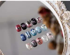 Detailed view of matte bow nail art stickers with 3D pearls and rhinestone elements