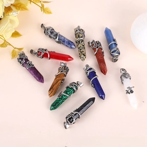 Macro detail of hexagonal crystal pendants with rose floral silver wire wrapping
