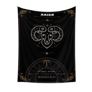 Detail of Aries zodiac tapestry featuring black fabric with gold celestial ram design