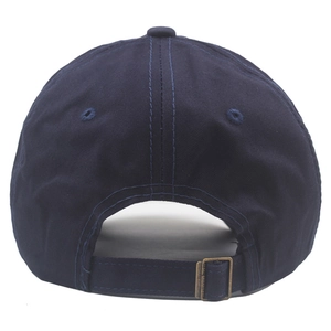 Detail view of navy cotton baseball cap showing bronze metal buckle and breathable eyelets