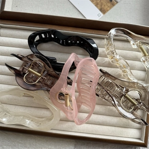 Various French style cloud hair claws in multiple colors inside a jewelry box