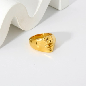 Artistic face relief ring in 18K gold plated stainless steel with high polish finish