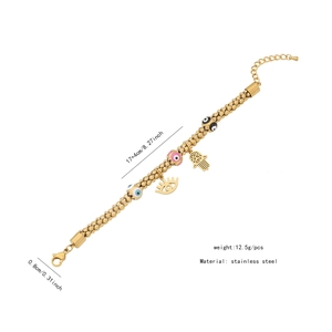 Detailed view of stainless steel gold bracelet with Evil Eye and Hamsa Hand charms