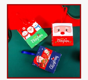 Detailed view of Merry Christmas gift boxes with festive patterns and silk handles