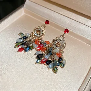 Boucles d'oreilles bohème en argent, cristal floral et pompons en perles colorées