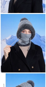 Detail of grey winter knit hat with pompom and adjustable neck warmer on model