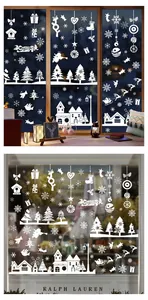 Detailed view of white Christmas window decals featuring reindeer and snowy trees