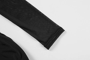 Detail of sheer black mesh sleeves with professional double-stitched cuffs on the dress