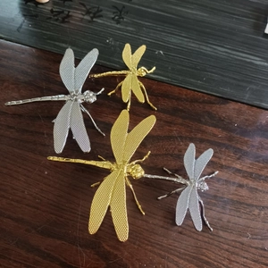 Detailed close-up of metallic dragonfly tea pet set with intricate wing textures