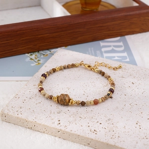 Vintage style handmade beaded bracelet with natural stones and golden lobster clasp