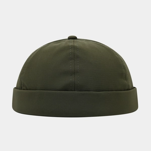 Detail showing the dark green docker hat texture with cross-stitch reinforcement on top
