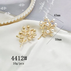 Detail showing gold leaf rose branch pendant size 59mm by 43mm with white pearls