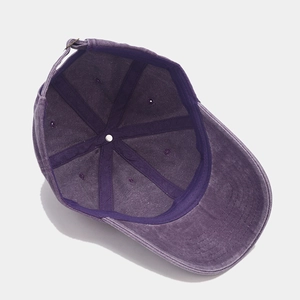 Detail view of the washed purple cotton baseball cap interior showing seams and structure