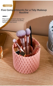 Pink rotating makeup brush holder with 5 compartments and stylish wavy texture detail