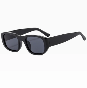 Detailed side view of bold black thick-frame sunglasses with wide temples and dark lenses