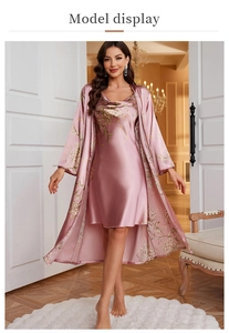 Detail of floral satin sleepwear set showing soft cowl neck and matching robe