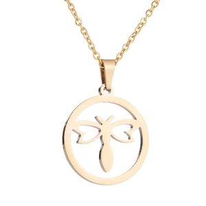 Detail shot of a hollow dragonfly pendant on a golden stainless steel necklace