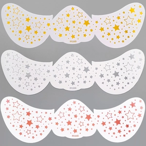 Detail view of gold, silver, and pink butterfly freckle patches with star patterns