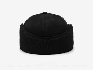 Rear view of black thermal skull cap featuring spliced matte fabric and textured fleece