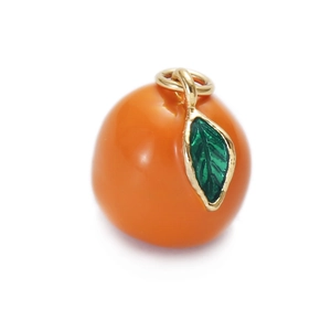 Detailed view of orange fruit pendant with green enamel leaf and golden hanging ring