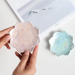Nordic embossed mandala ceramic jewelry tray with iridescent pink and blue glaze