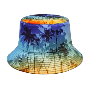 Detail of tropical palm tree sunset print and reinforced stitching on fisherman bucket hat