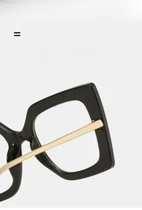 Detail of square black frame glasses with metallic gold temples and sturdy hinges