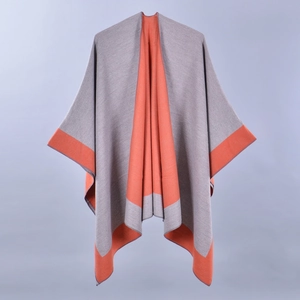 Grey knit shawl cape with orange trim, elegant spring poncho for women made of soft cashmere-like fabric