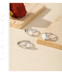 Detailed view of S925 sterling silver opal rings with cubic zirconia on stone pedestals