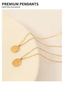 Detail of 18K gold-plated oval pendant necklace featuring 'you are adorable' engraving