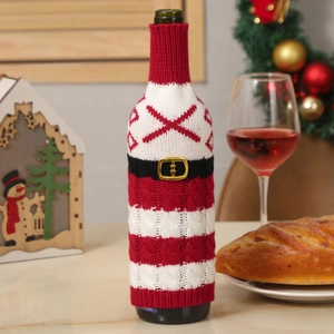 Christmas knitted wine bottle cover with red and white snowflake patterns and belt buckle