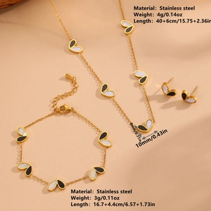 Gold stainless steel black and white heart necklace, bracelet, and earring jewelry set